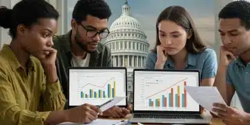 Students reviewing loan documents with a laptop, symbolizing effective repayment strategies for 2025.